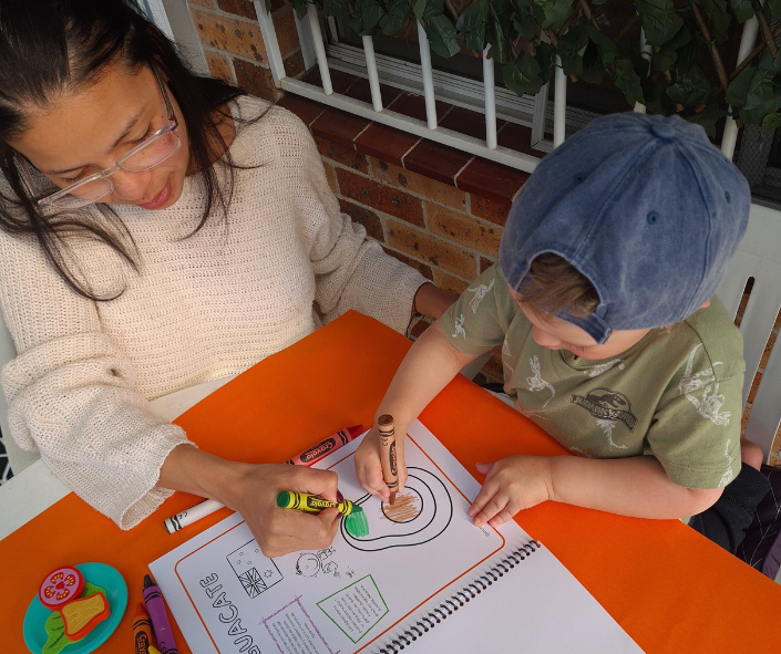 Mom and son colouring avocado